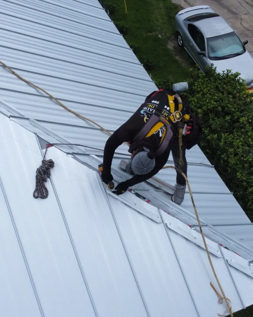 a worker completing a roofing project